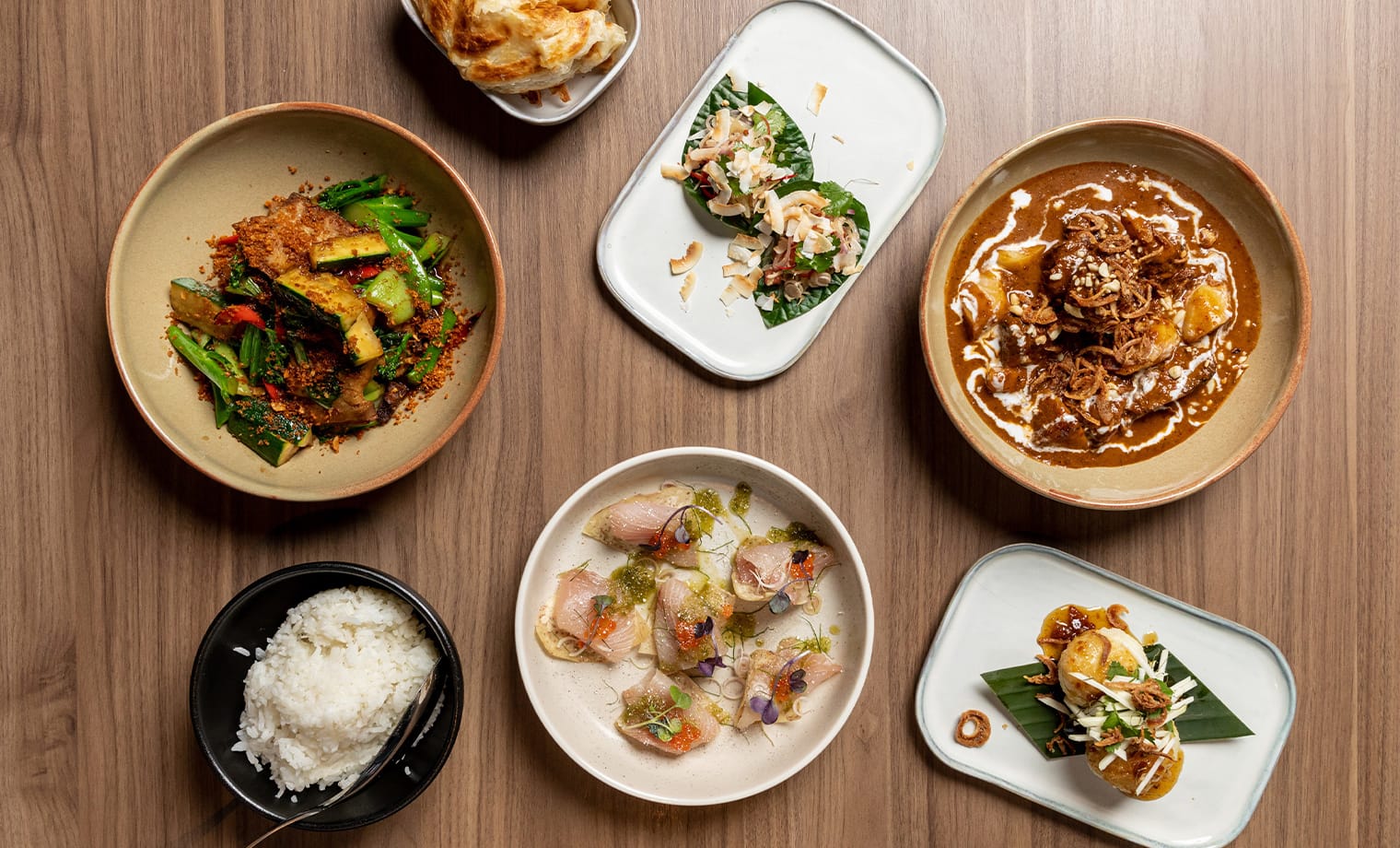 A shared banquet spread laid out for a function at Salted Egg Melbourne